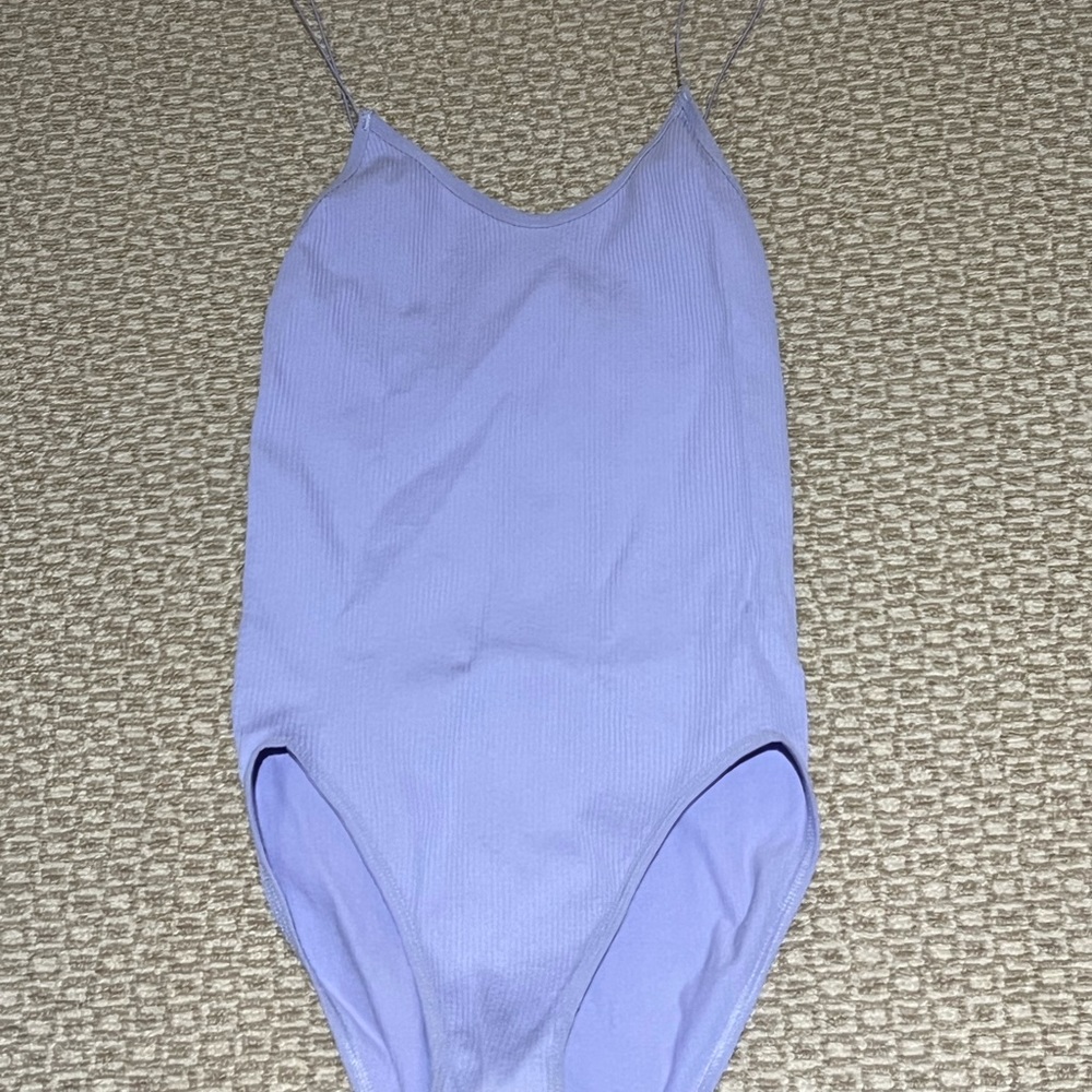 Purple out from under body suit